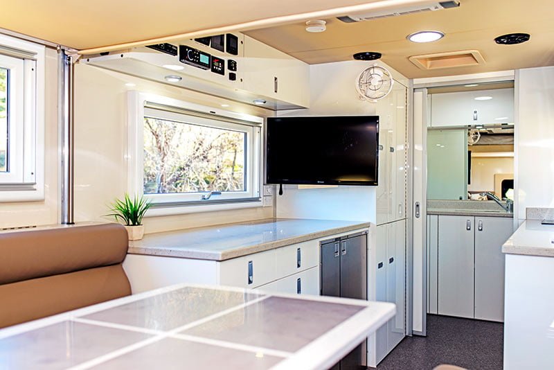 SLRV RVs interior - kitchen with TV